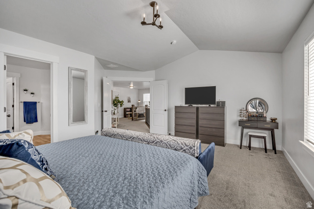 1577 Quailhill Road Saratoga Springs, UT 84045 - Photo 19 of 46 Carpeted primary bedroom with vaulted ceiling and ensuite bath