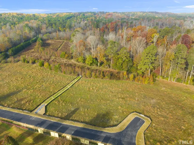 a view of a swimming pool with an outdoor space and seating area