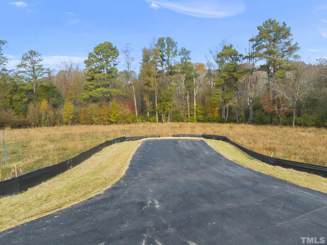 a view of a lake with houses in the back
