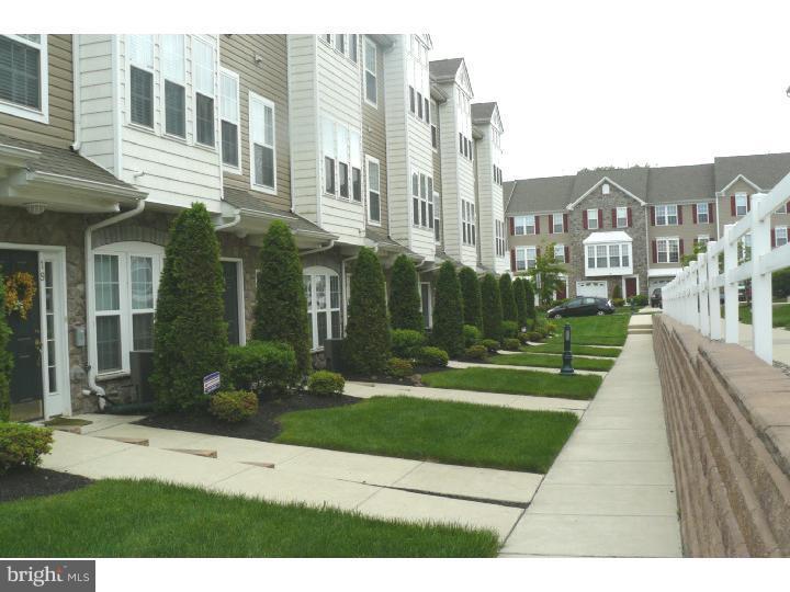 a view of a building with a yard