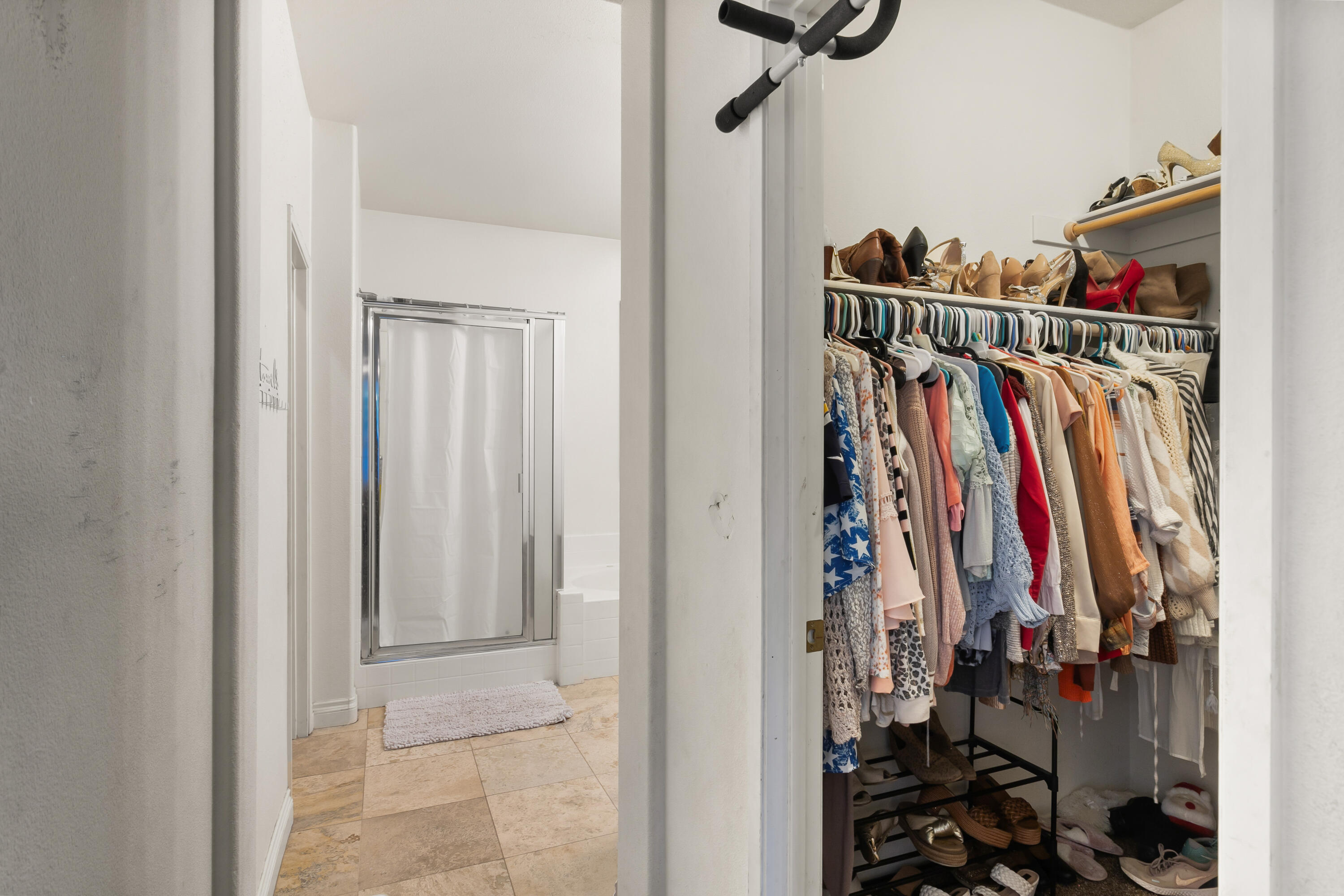 49870 Lewis Road Indio, CA 92201 - Photo 20 of 47 a view of walk in closet with clothes