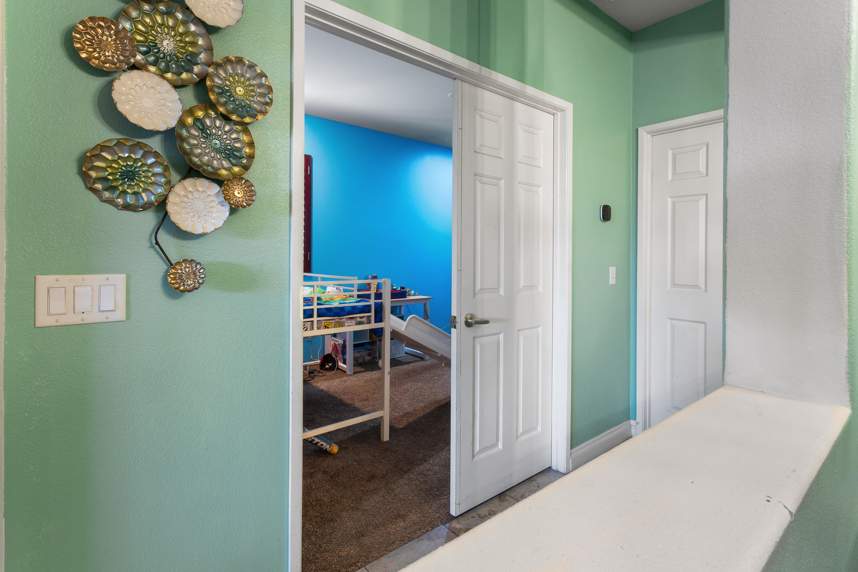 49870 Lewis Road Indio, CA 92201 - Photo 36 of 47 a bedroom with a bed and a chandelier