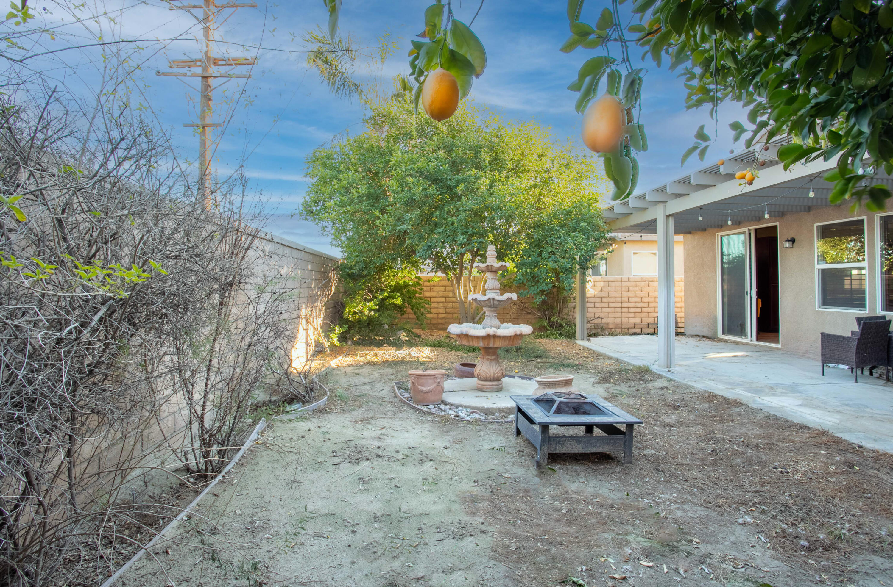 49870 Lewis Road Indio, CA 92201 - Photo 41 of 47 a backyard of a house with table and chairs