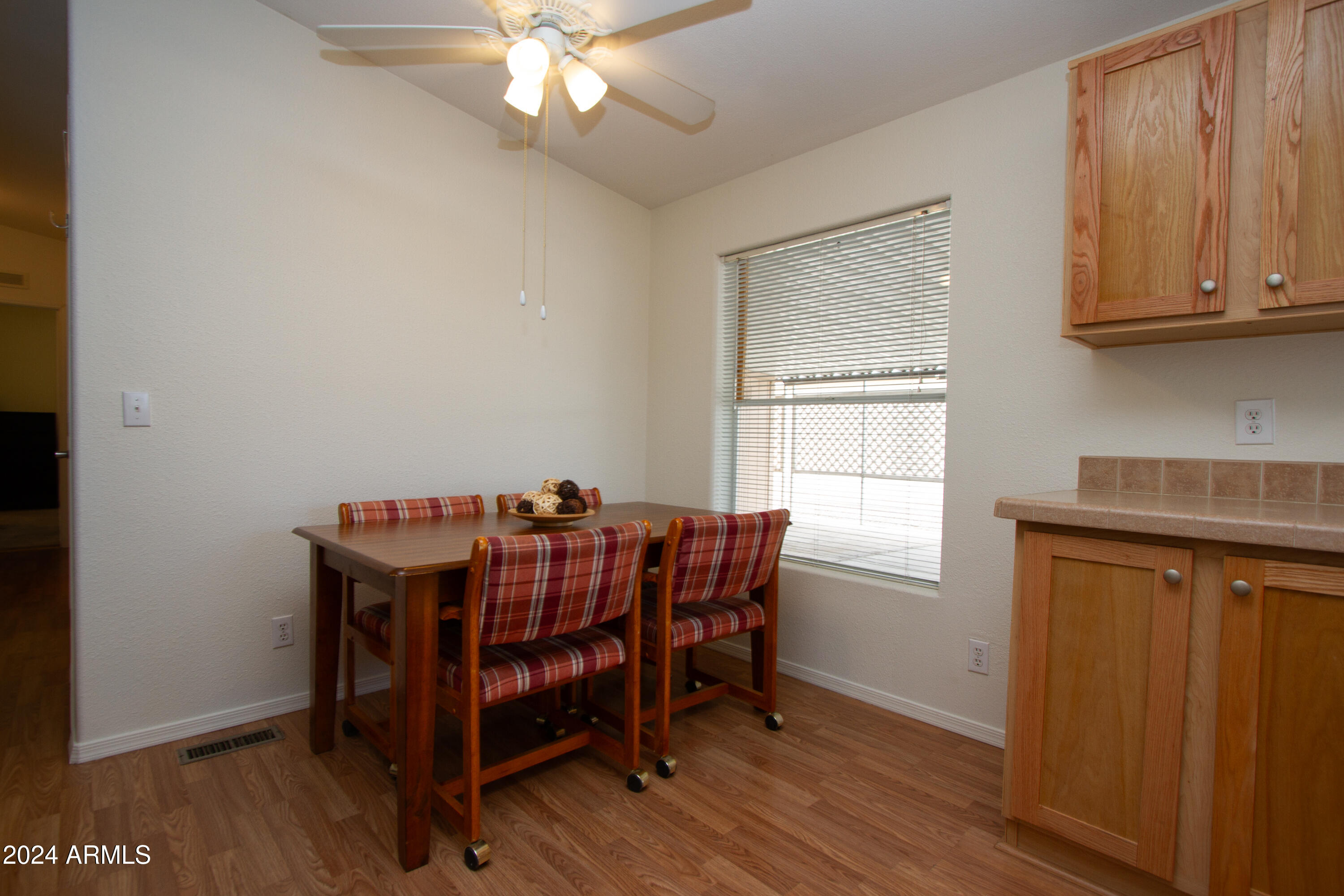 3700 South Tomahawk Road, Unit 93 Apache Junction, AZ 85119 - Photo 15 of 40 a view of a dining room with furniture and chandelier