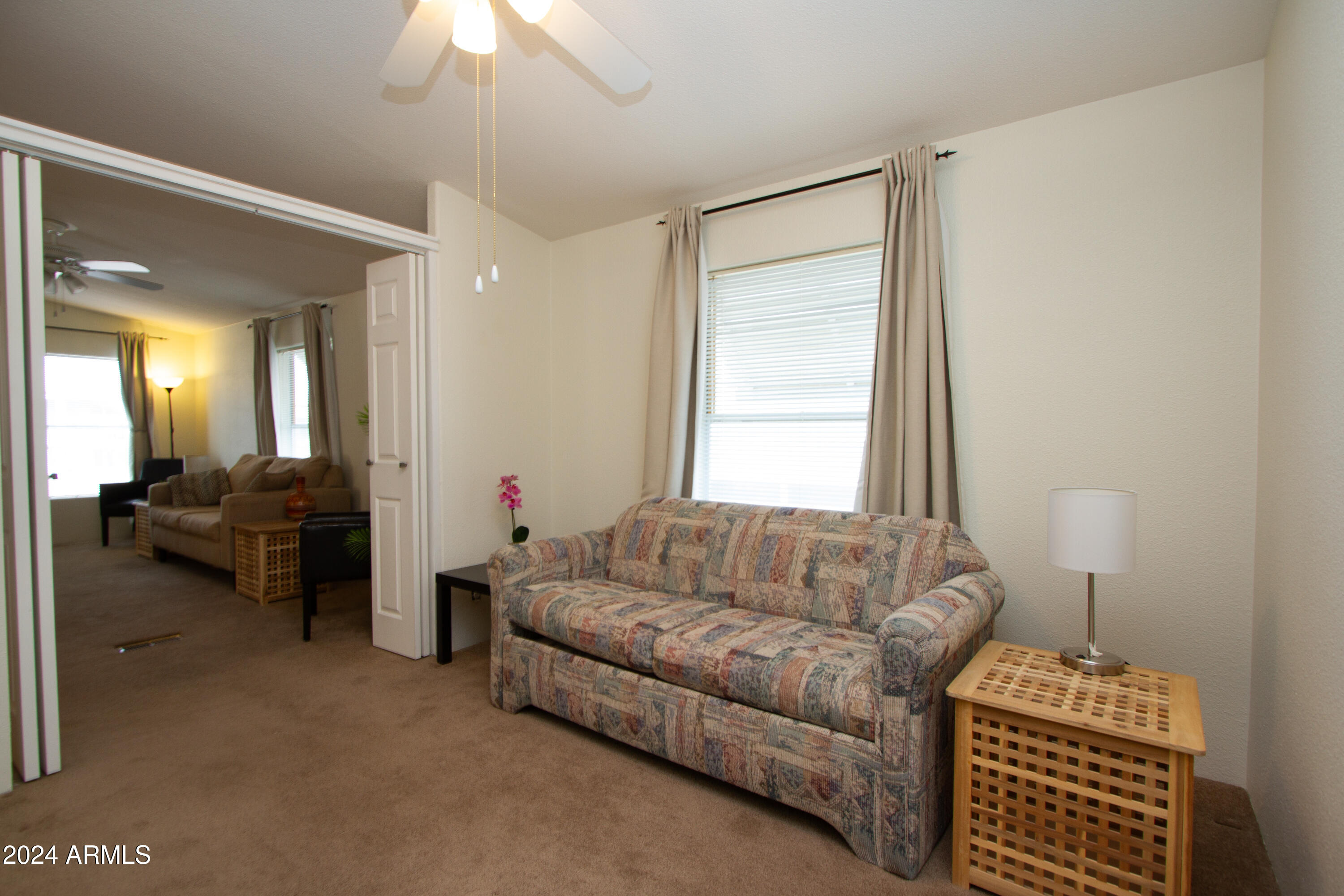 3700 South Tomahawk Road, Unit 93 Apache Junction, AZ 85119 - Photo 28 of 40 a living room with furniture and a window