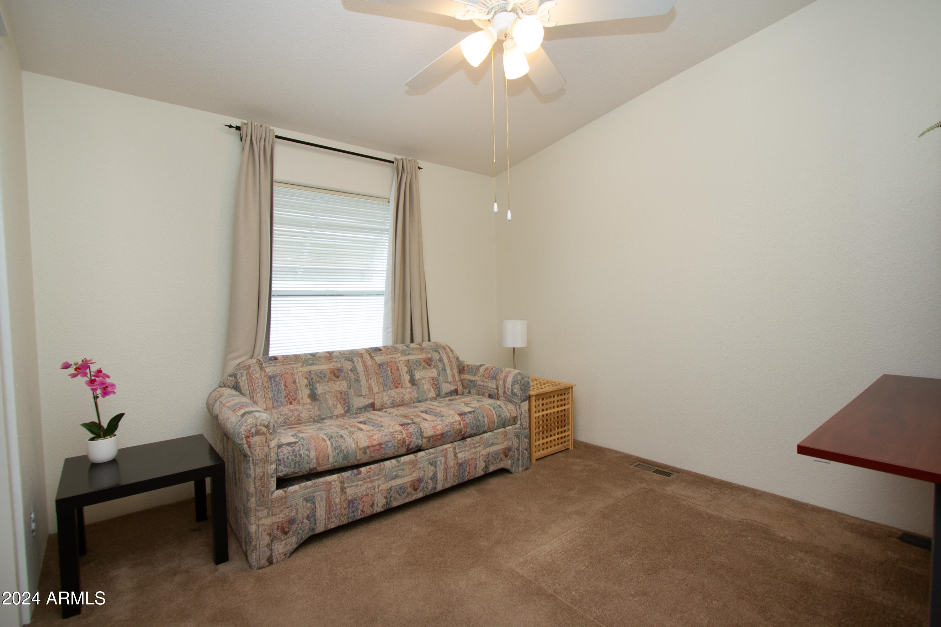 3700 South Tomahawk Road, Unit 93 Apache Junction, AZ 85119 - Photo 29 of 40 a living room with furniture and a chandelier