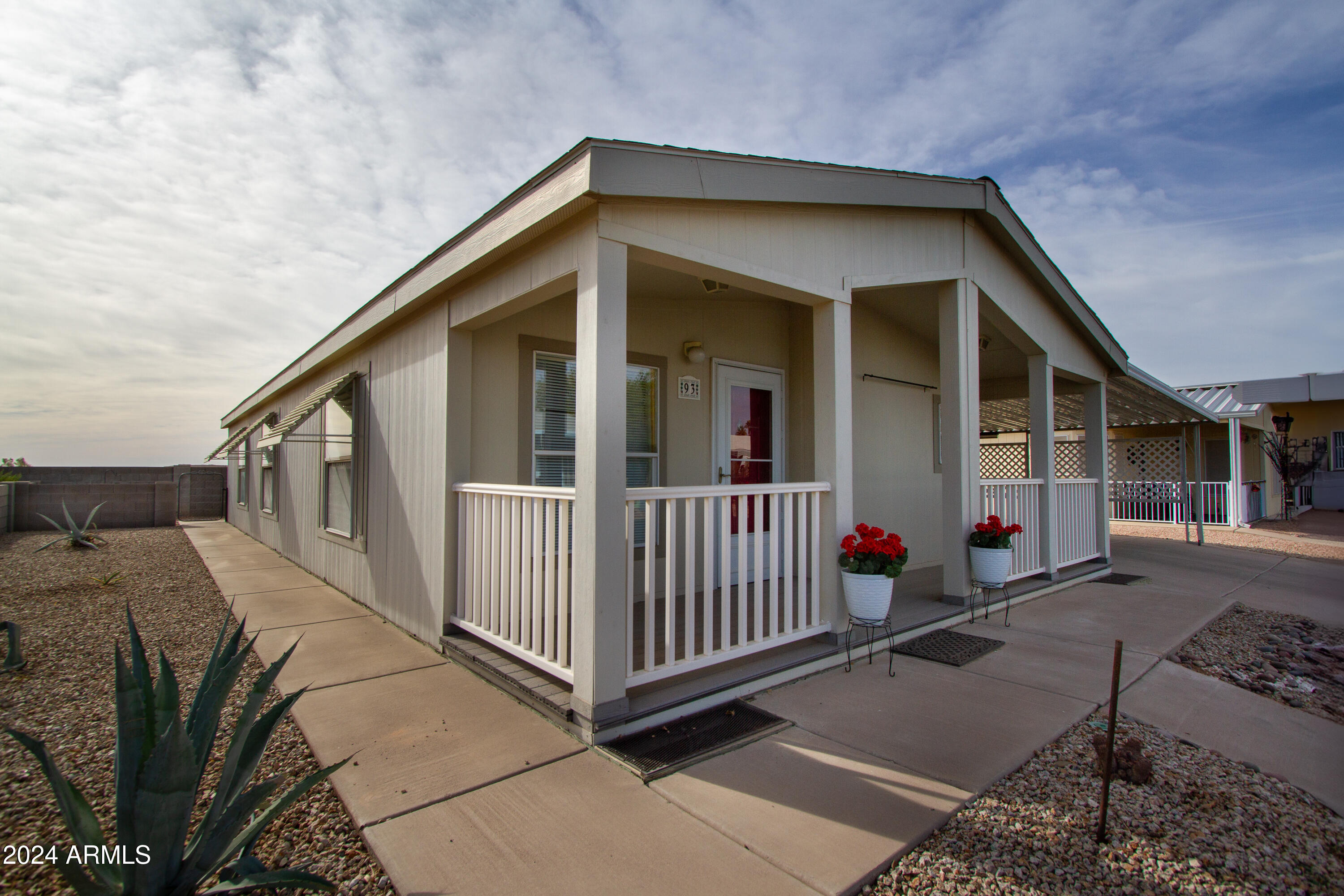 3700 South Tomahawk Road, Unit 93 Apache Junction, AZ 85119 - Photo 5 of 40 a view of a house with wooden fence