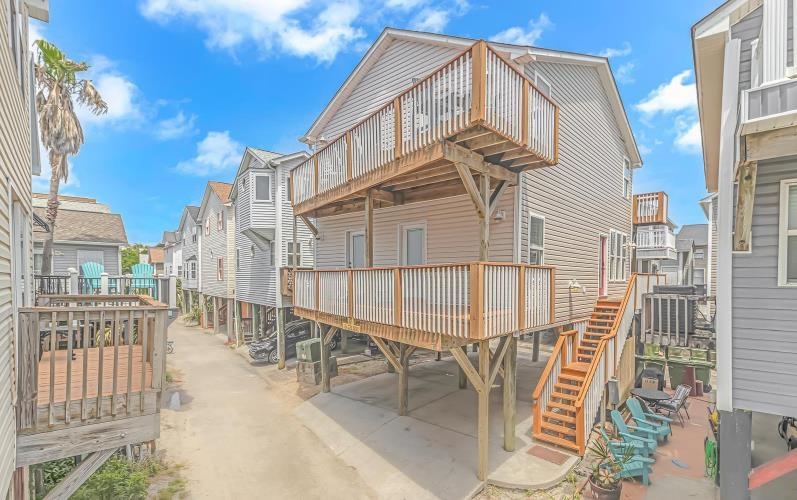 1171 Neptune Road Myrtle Beach, SC 29577 - Photo 1 of 29 Rear view of property featuring a wooden deck, a residential view, and stairs