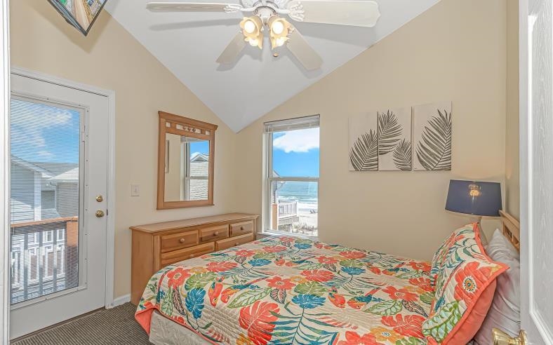 1171 Neptune Road Myrtle Beach, SC 29577 - Photo 8 of 29 Carpeted bedroom featuring access to exterior, vaulted ceiling, and ceiling fan