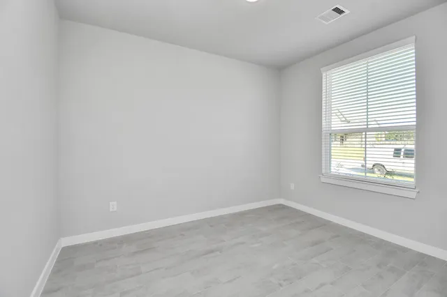a kitchen with a stove sink and cabinets