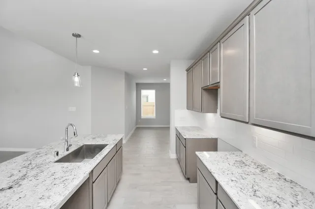 a bedroom with bed tv and window