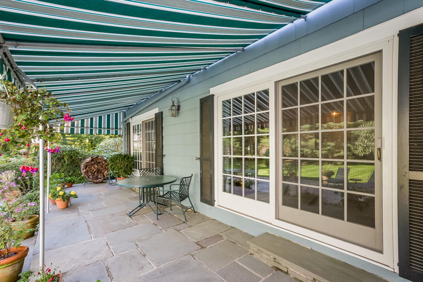 14 Meadowbrook Road Darien, CT 06820 - Photo 35 of 40 a view of a porch with chairs and potted plants
