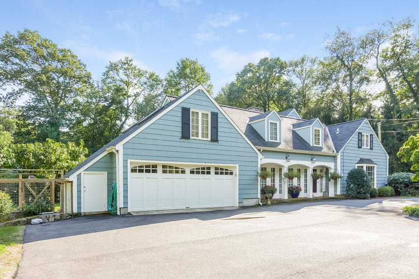 14 Meadowbrook Road Darien, CT 06820 - Photo 4 of 40 a view of a house with a yard and potted plants