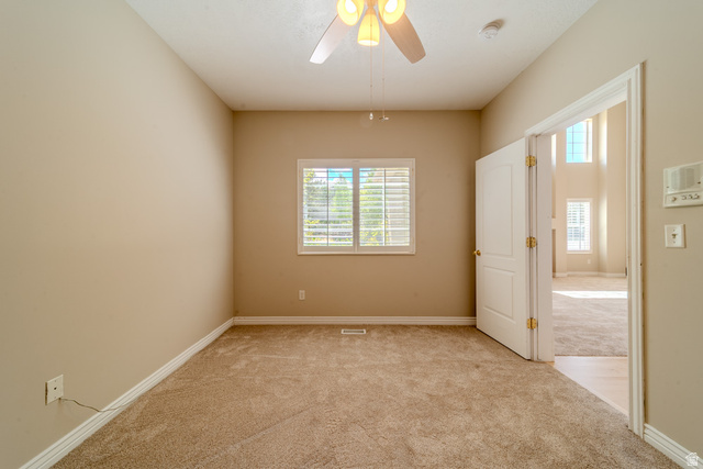 598 Hollow Creek Road Draper, UT 84020 - Photo 68 of 110 Carpeted room with neutral tone walls and white baseboards