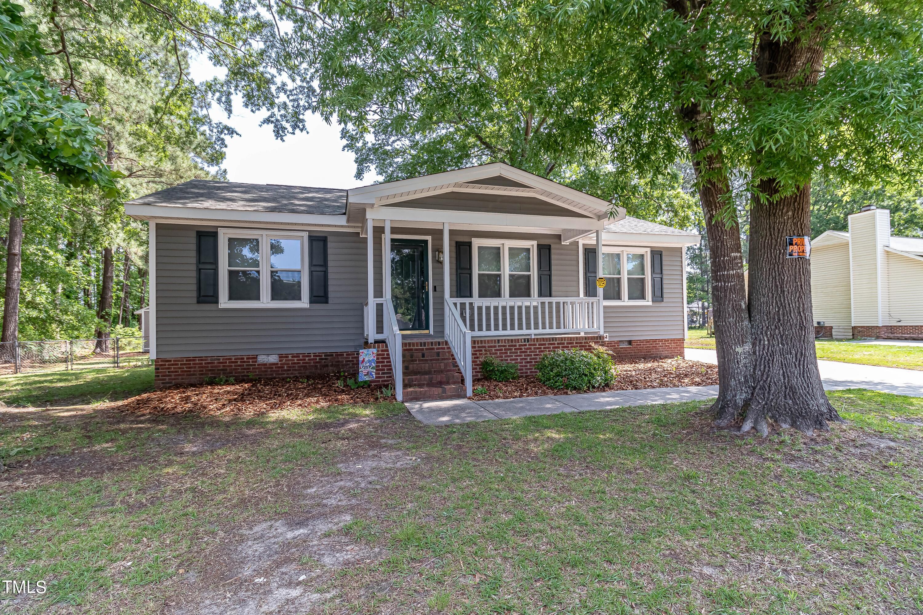 410 Barbour Road Smithfield, NC 27577 - Photo 1 of 16 a front view of a house with yard and green space