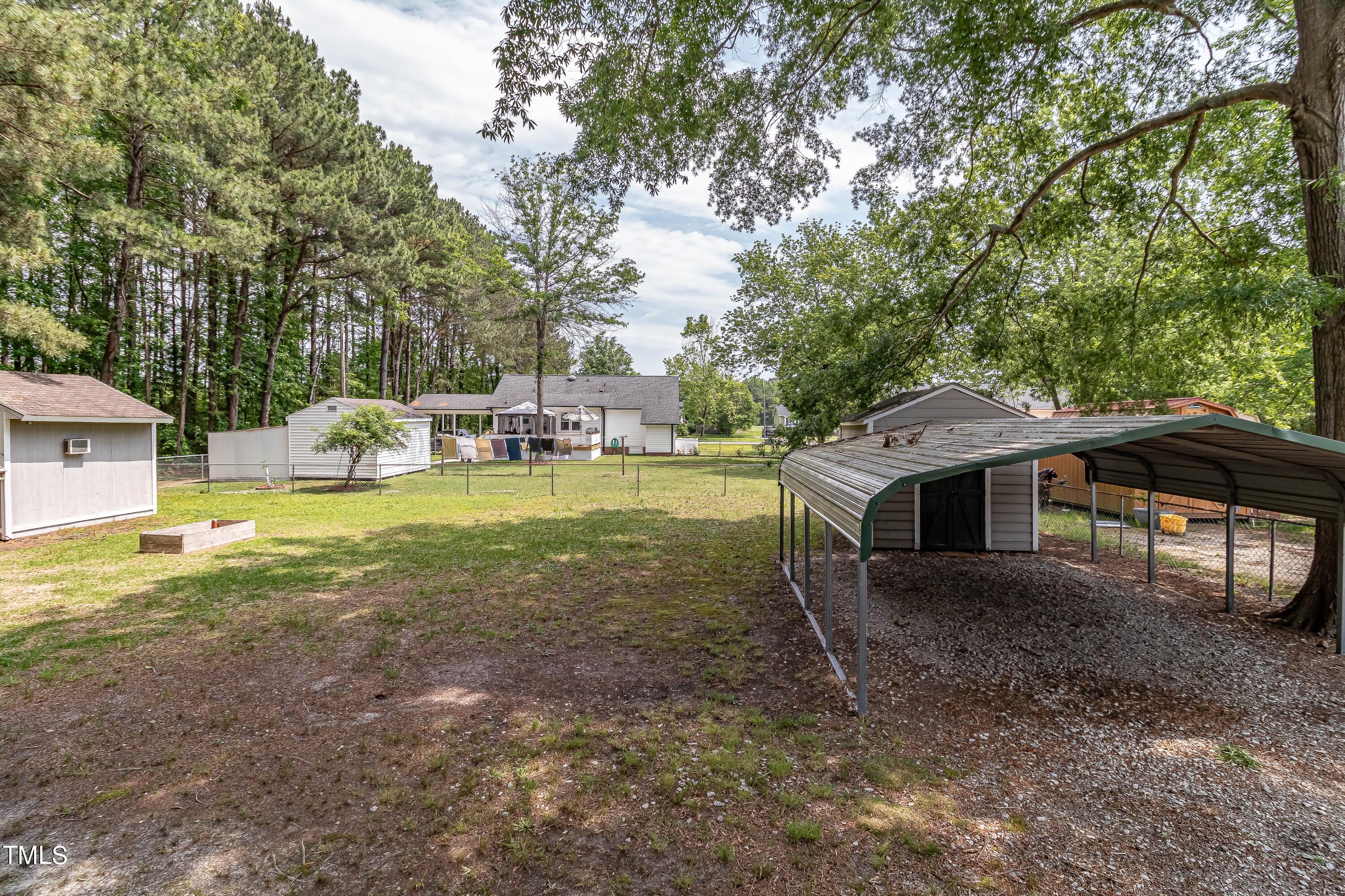 410 Barbour Road Smithfield, NC 27577 - Photo 11 of 16 a view of a house with yard and sitting area