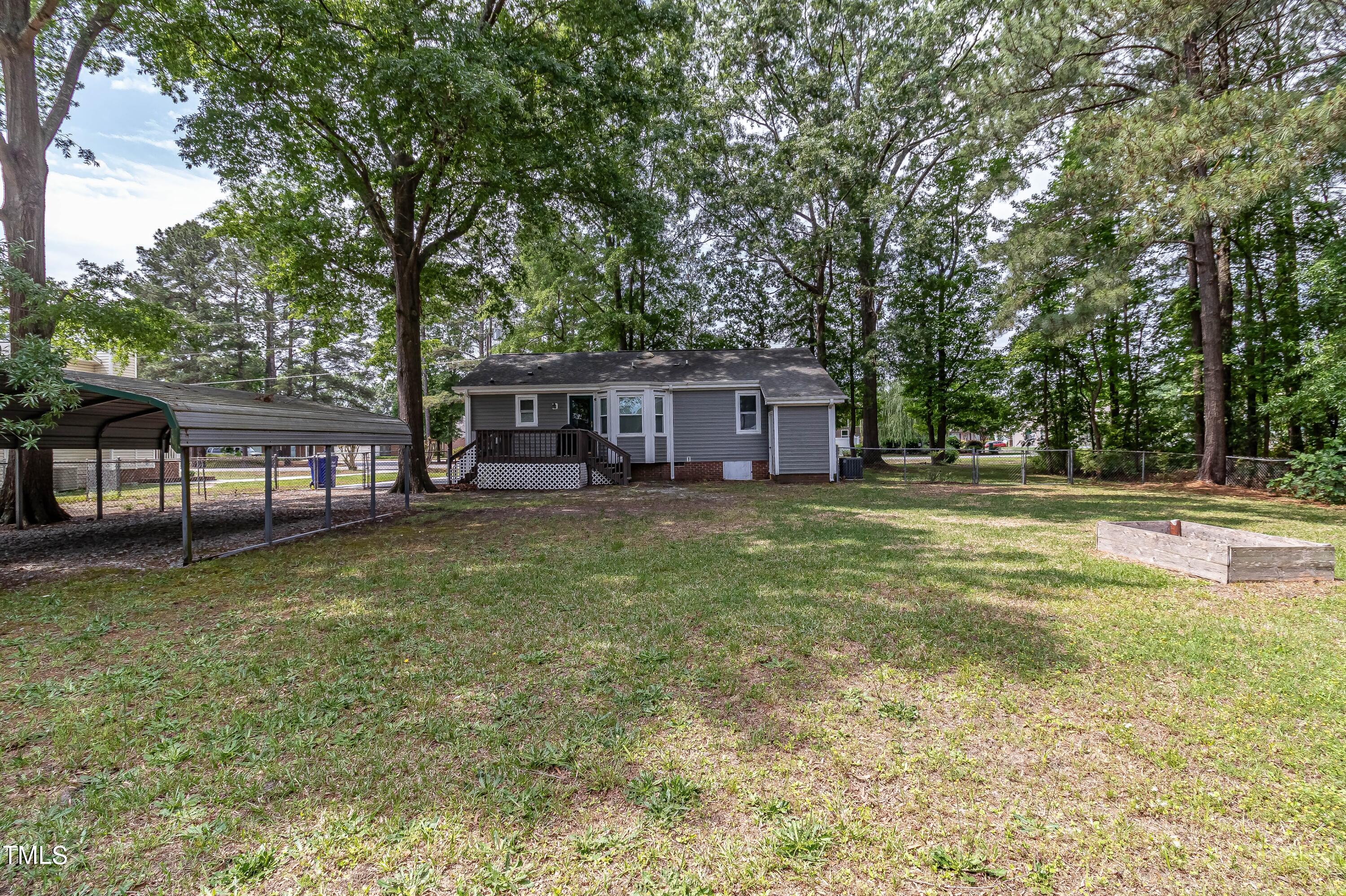 410 Barbour Road Smithfield, NC 27577 - Photo 15 of 16 a house view with a garden space