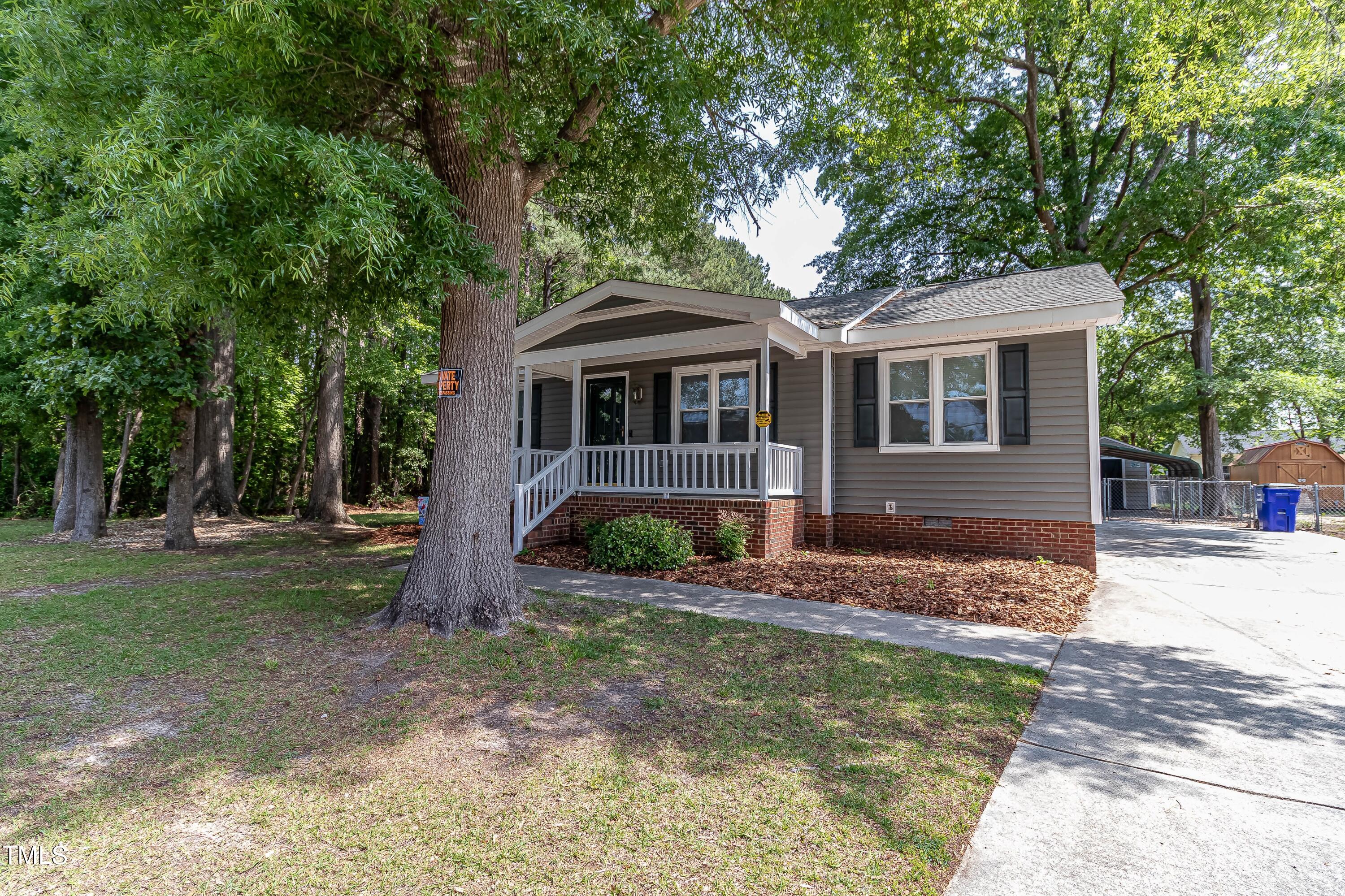 410 Barbour Road Smithfield, NC 27577 - Photo 2 of 16 a front view of a house with a yard