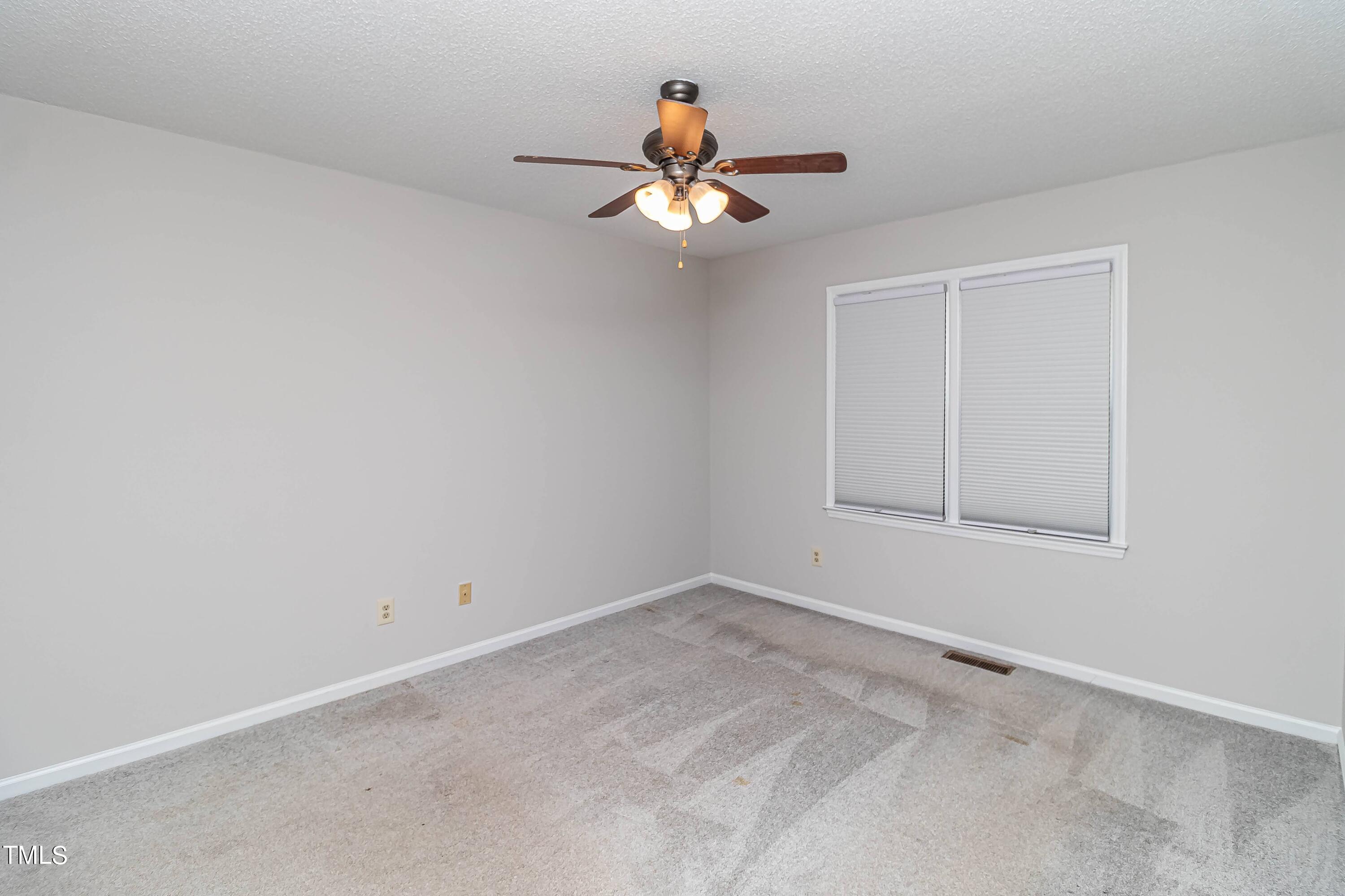 410 Barbour Road Smithfield, NC 27577 - Photo 6 of 16 a window in an empty room