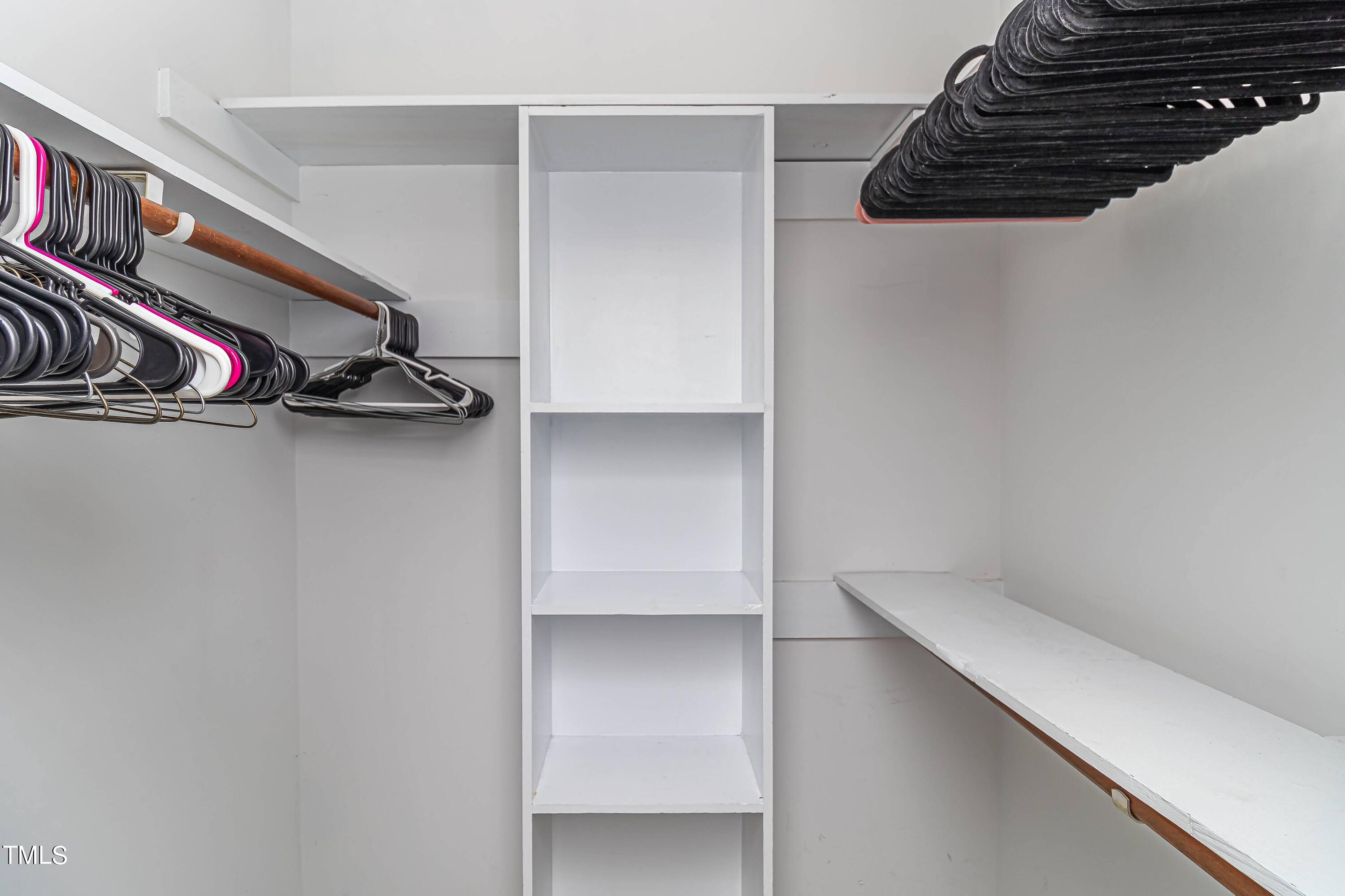 410 Barbour Road Smithfield, NC 27577 - Photo 7 of 16 a view of walk in closet with clothes and shoes