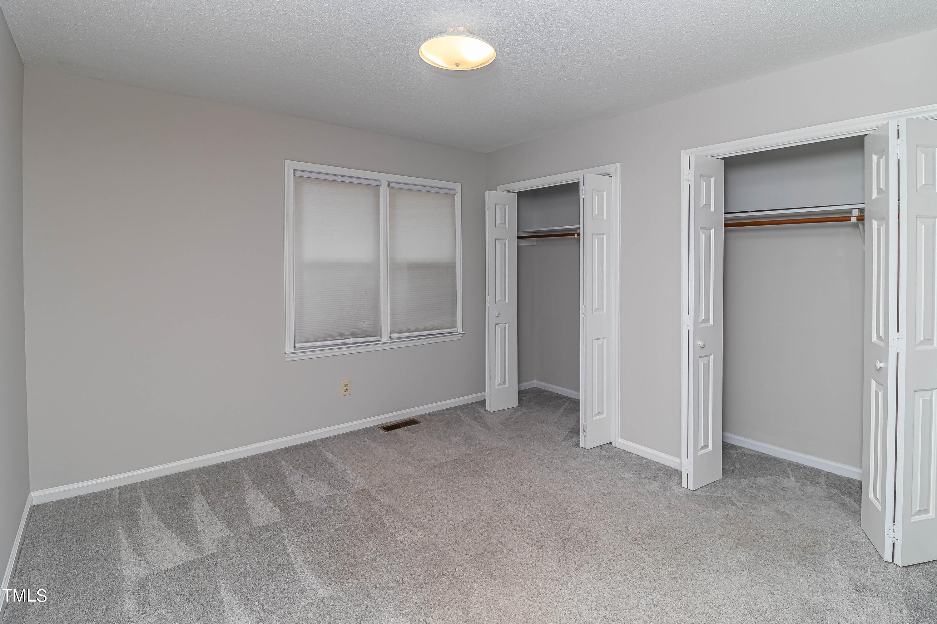 410 Barbour Road Smithfield, NC 27577 - Photo 8 of 16 a view of an empty room with a window