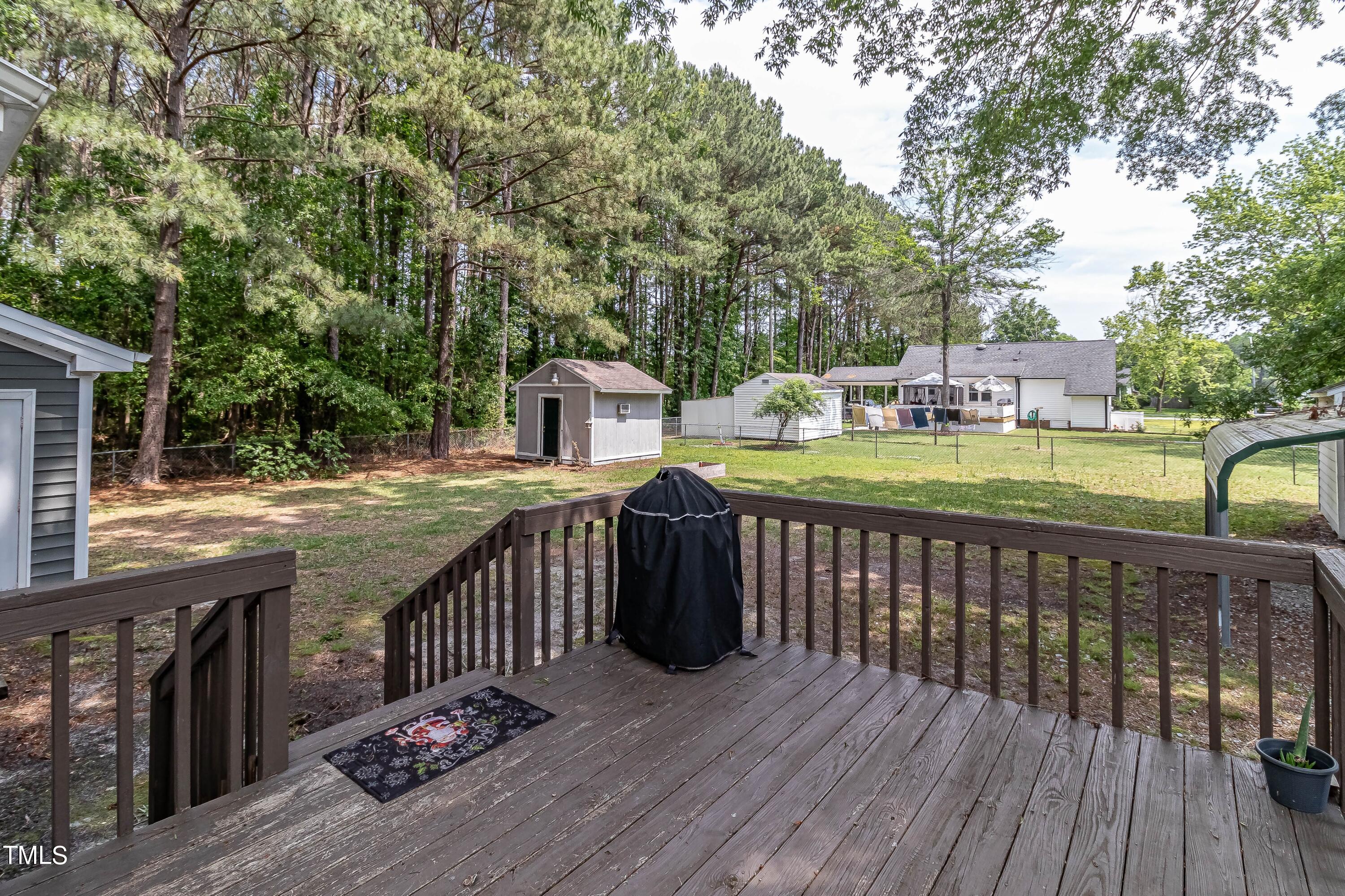 410 Barbour Road Smithfield, NC 27577 - Photo 10 of 16 a view of balcony with wooden floor and seating space