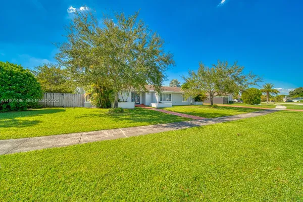 a view of a house with a big yard