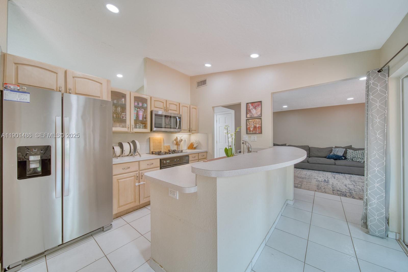 10860 Southwest 124th Road Miami, FL 33176 - Photo 13 of 47 a kitchen with stainless steel appliances a refrigerator sink and stove