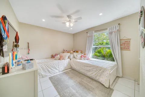 a room with a bed and a chandelier