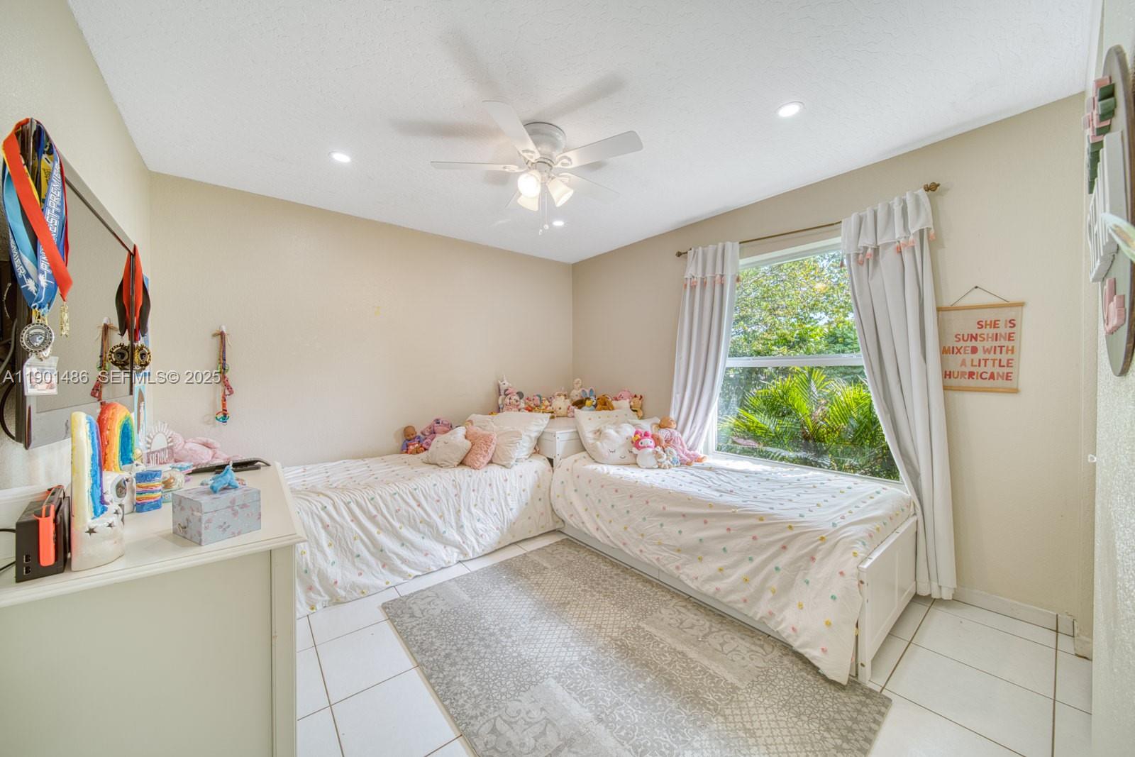 10860 Southwest 124th Road Miami, FL 33176 - Photo 18 of 47 a room with a bed and a chandelier