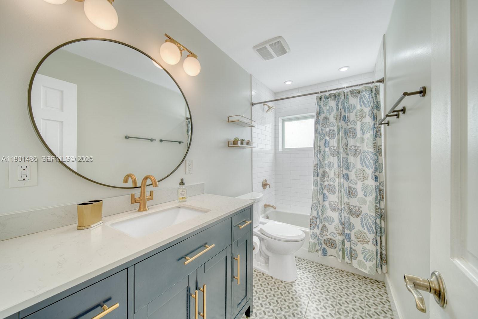 10860 Southwest 124th Road Miami, FL 33176 - Photo 20 of 47 a spacious bathroom with a sink a toilet a mirror and a shower