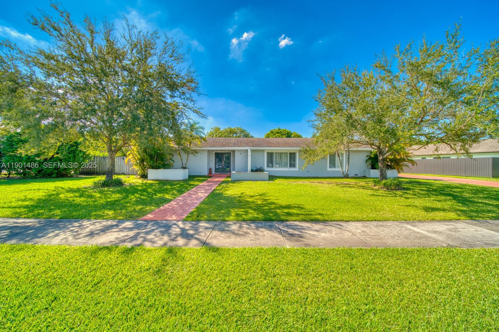 10860 Southwest 124th Road Miami, FL 33176 - Photo 2 of 47 a view of green field with tree in front of it