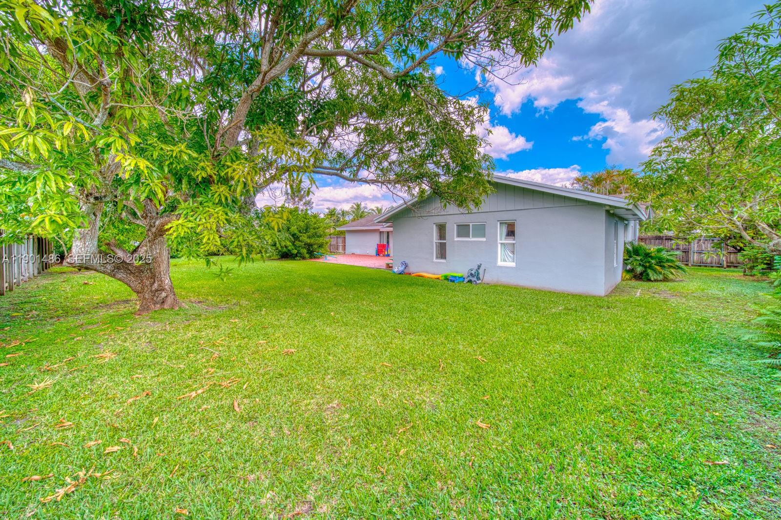 10860 Southwest 124th Road Miami, FL 33176 - Photo 29 of 47 a view of a house with a yard