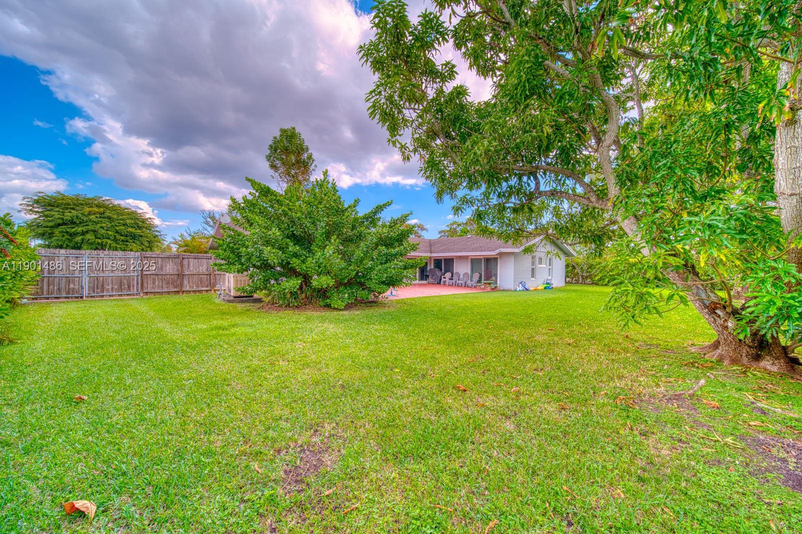 10860 Southwest 124th Road Miami, FL 33176 - Photo 31 of 47 a view of a house with a backyard