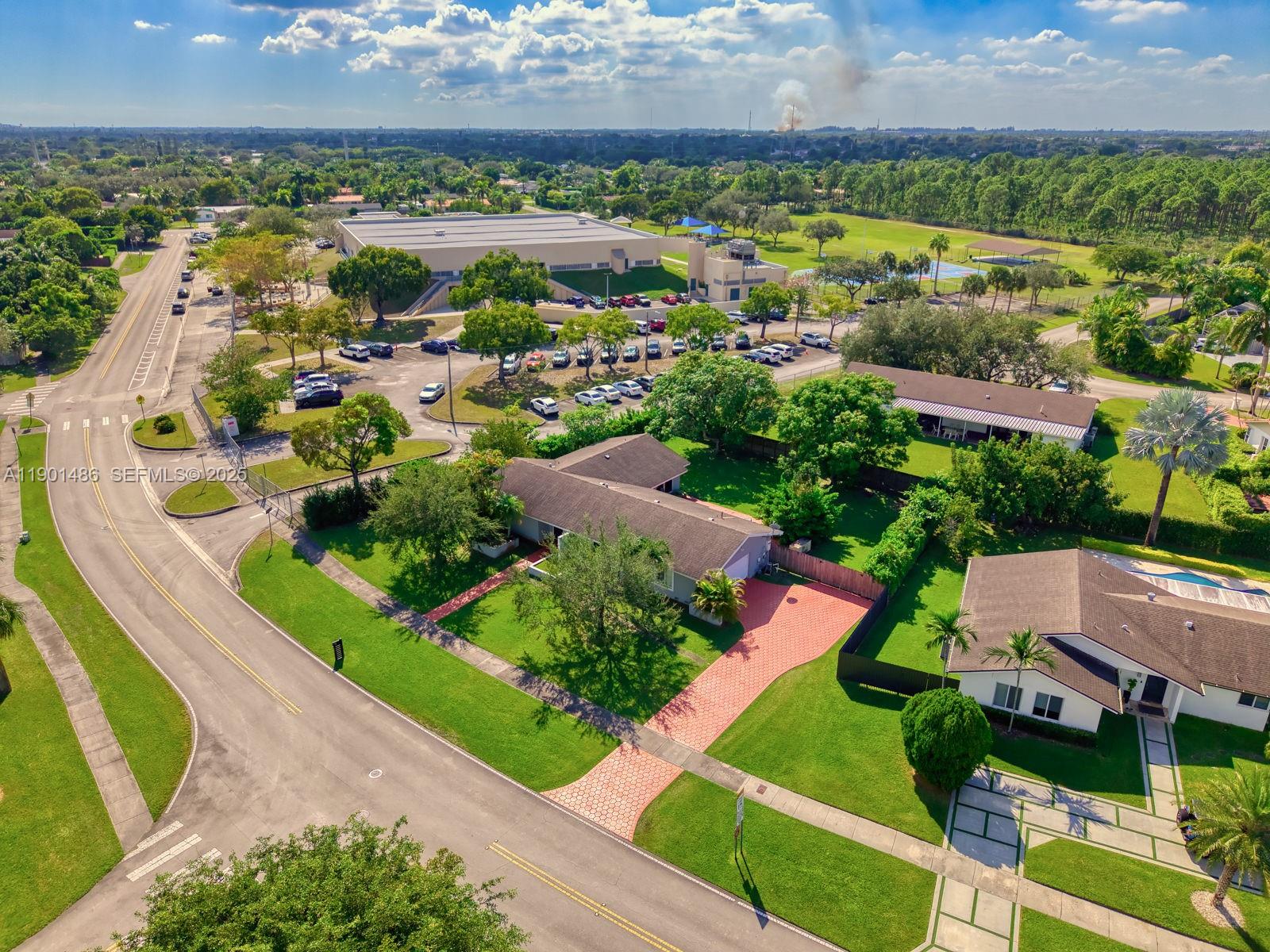 10860 Southwest 124th Road Miami, FL 33176 - Photo 32 of 47 an aerial view of residential houses with outdoor space and street view