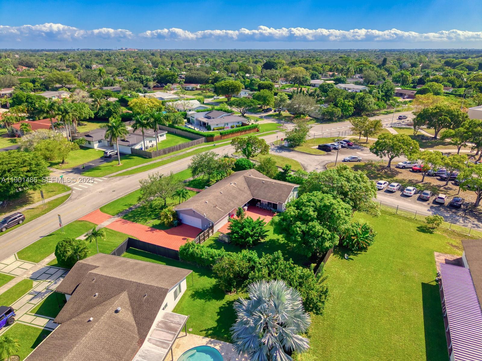 10860 Southwest 124th Road Miami, FL 33176 - Photo 35 of 47 an aerial view of residential houses with outdoor space and river