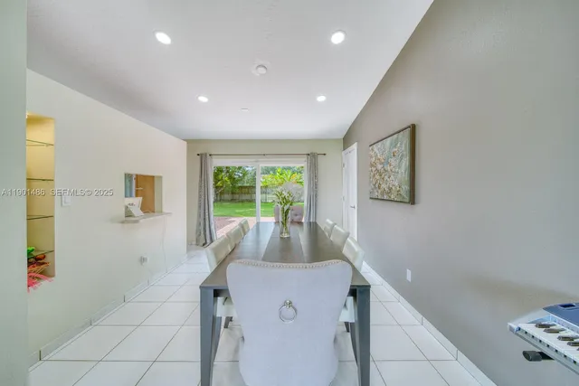 a view of a livingroom with furniture and a window