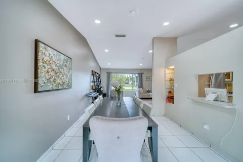 a view of a living room and chandelier
