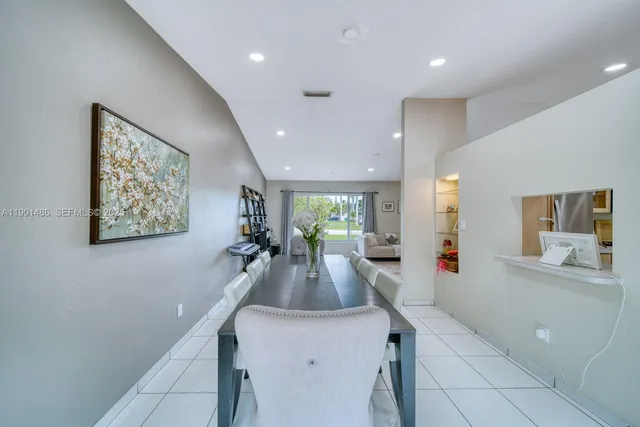a view of a living room and chandelier