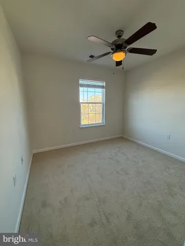 a bathroom with a toilet and a bath tub