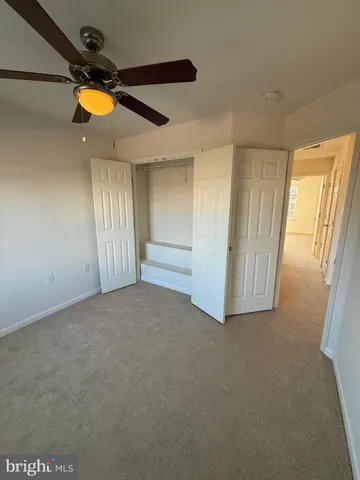 a large kitchen with stainless steel appliances granite countertop a stove a sink and a refrigerator