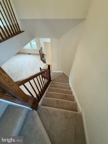 a bathroom with a sink mirror vanity and toilet