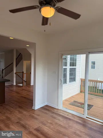 a view of a house with big yard and a deck