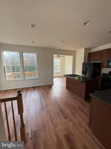 a view of a house with swimming pool and sitting area
