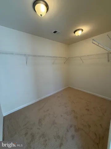 a bathroom with a tub a toilet and a shower