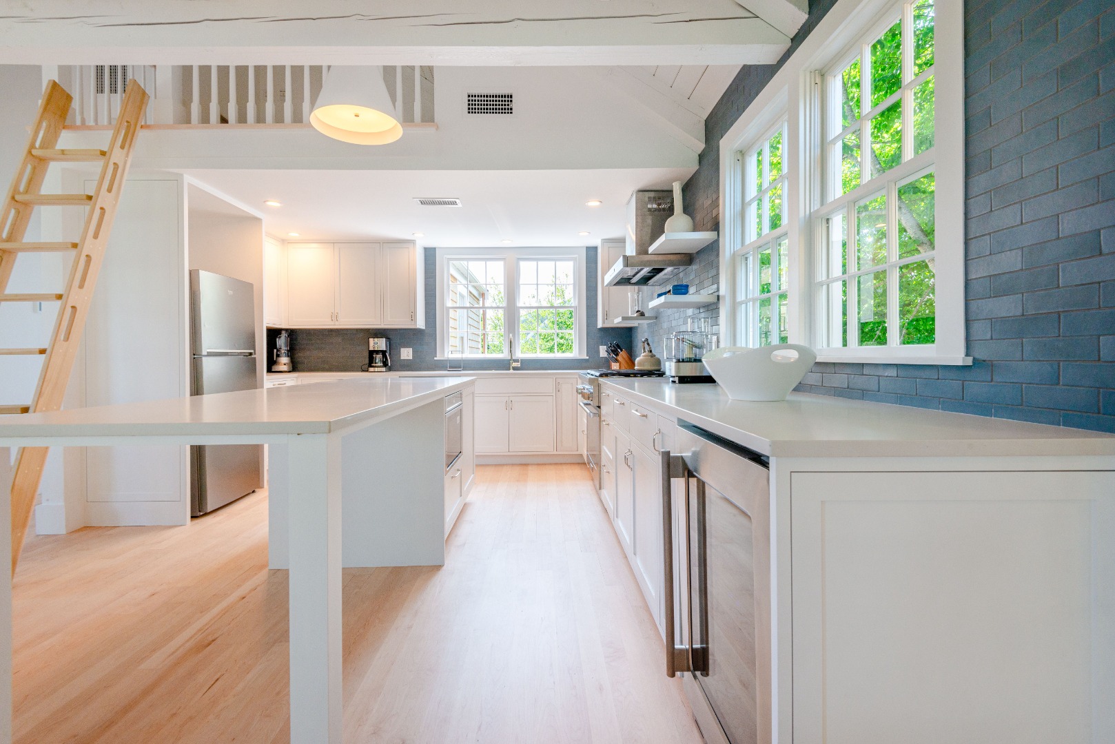 12 Willard Street Nantucket, MA 02554 - Photo 13 of 36 a large white kitchen with a large window