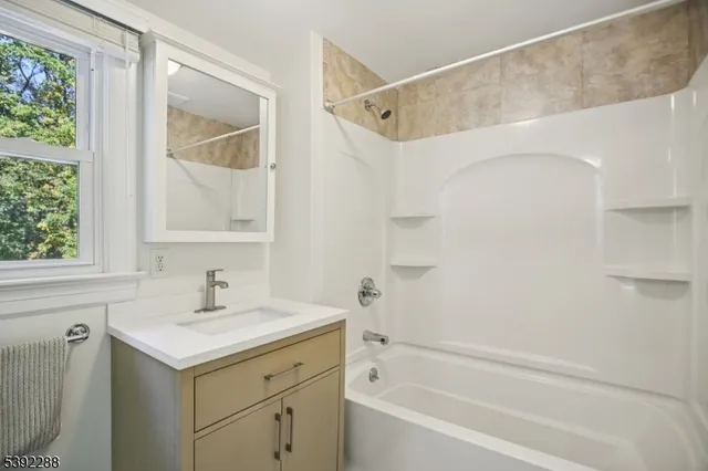 a bathroom with a sink and a bathtub
