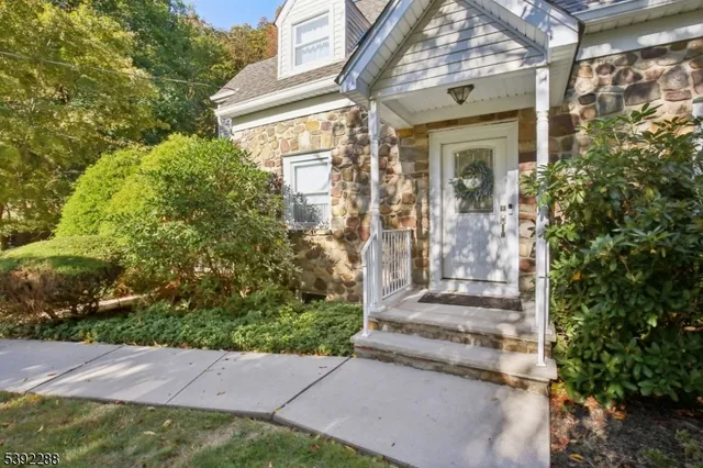 a view of a house with a small yard