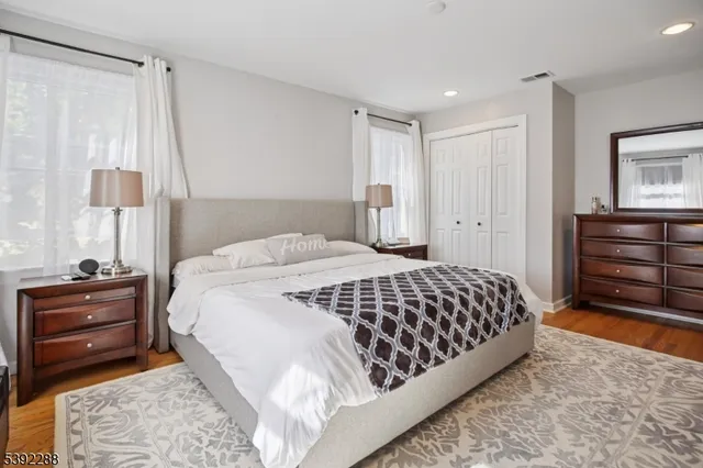 a bedroom with a bed and a dresser