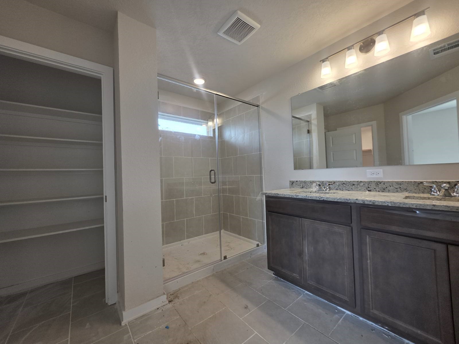 1498 Lk Rdg Drive Brenham, TX 77833 - Photo 8 of 14 a bathroom with a granite countertop sink mirror and shower
